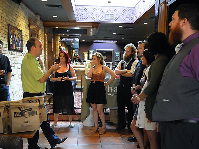 Thatcher's Organic Liquors central region manager Johnathan Schulz explains the rules of the cocktail contest to the bartender participants on Monday, Aug 17, at Red Carpet Martini Lounge. Bartenders were given twenty minutes to create a cocktail with the ingredients they were given.  Briana Sanchez, BSanchez@stcloud, Briana Sanchez, BSanchez@stcloud